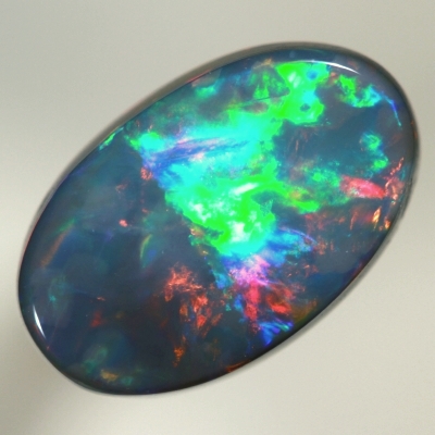 SOLID BLACK OPAL Top quality. Rolling flashes of cherry red and magenta, bright green and purple. SEE VIDEO